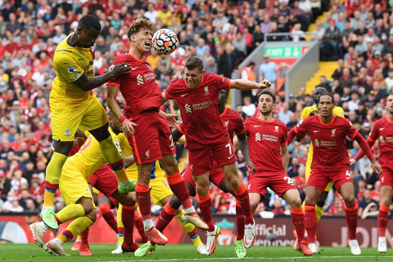 Crystal Palace defender Marc Guehi challenges Liverpool defender Kostas Tsimikas. AFP