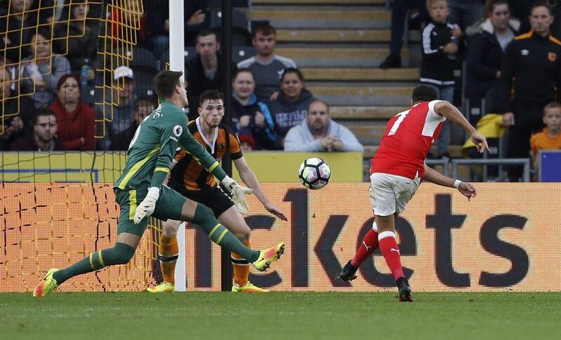 Arsenal’s Alexis Sanchez scores their third goal. Lee Smith / Action Images / Reuters