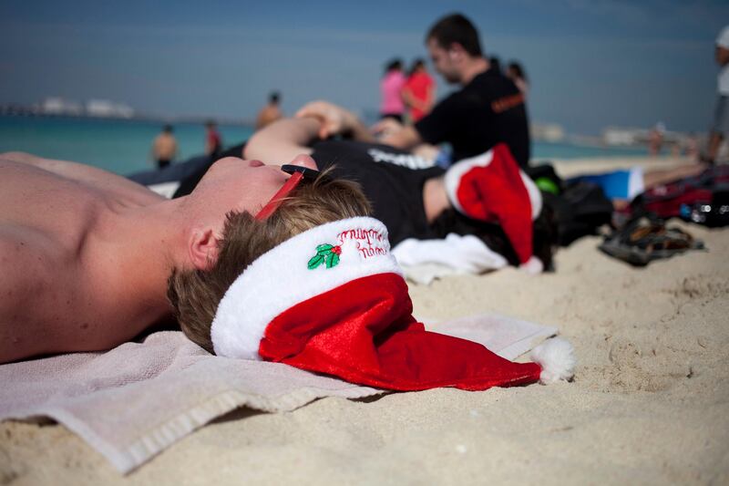Dubai, United Arab Emirates - December 25 2012 - Nick Cifranic, 19, a student at the Rochester Institute of Technology enjoys the sunshine at the JBR beach on Christmas day. Nick is in Dubai for a study abroad program from Rochester, New York. (Razan Alzayani / The National) 