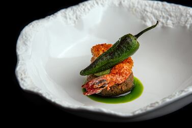 Food trend: fine dining will make a comeback in 2021. as people look to elevate their restaurant experiences after a year of dining in. Seen here, prawn, kothimbir vadi, fennel and tamarind curry by chef Himanshu Saini at Tresind Studio, Dubai 