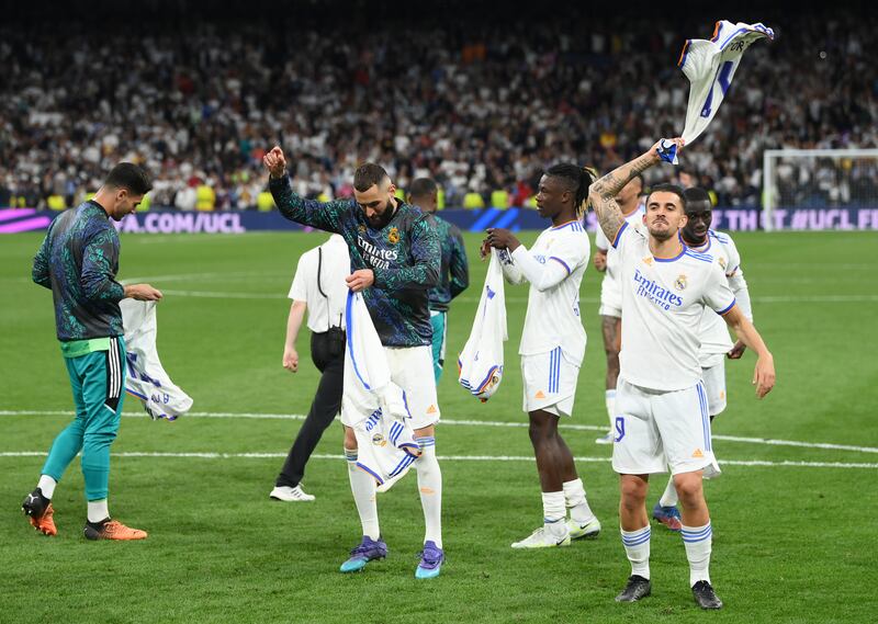 Karim Benzema and Real players celebrate. Getty