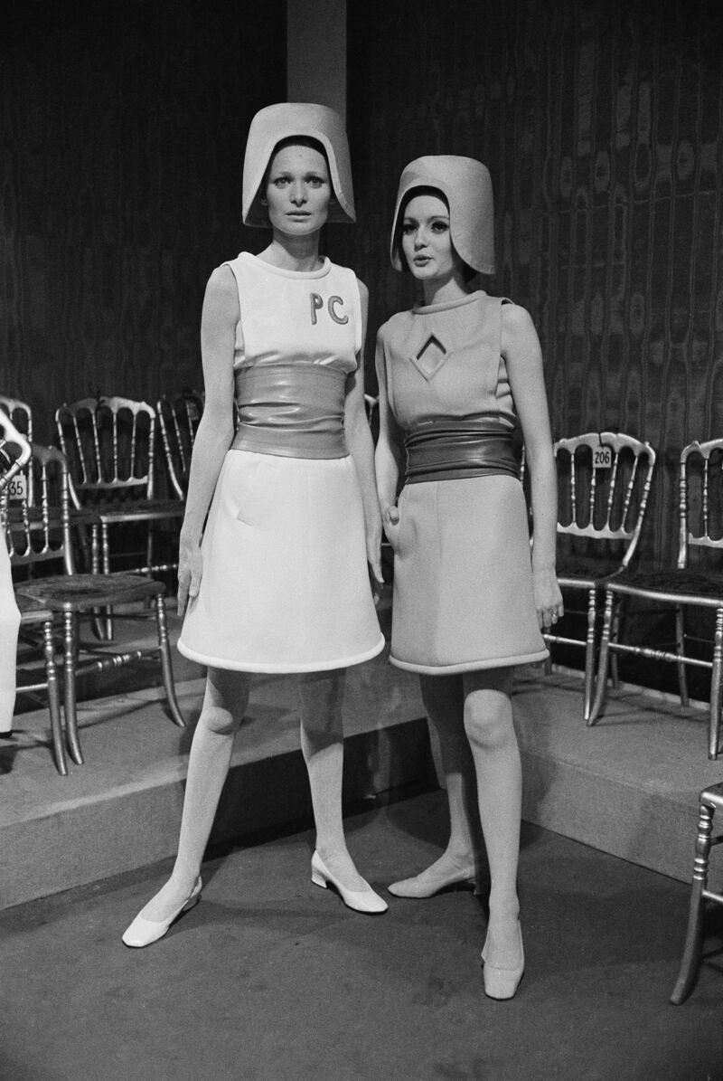 Two sleeveless belted dresses by Pierre Cardin at a fashion show, 1967. They are worn with helmet-style hats. (Photo by Reg Lancaster/Express/Getty Images)