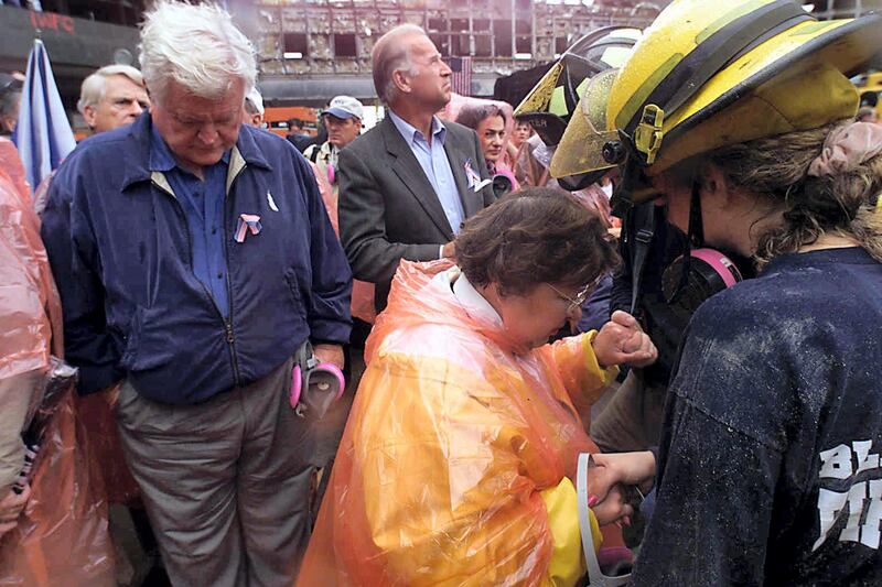 US Senators Ted Kennedy (L), D-MA, Joe Biden (C), D-DE, and Barbara Mikulski (R), D-MD, tour ground zero 20 September 2001 in New York, nine days after the destruction of the World Trade Center. Only five people have been found alive since the landmark twin towers collapsed on the morning of 11 September after being hit by two hijacked airliners in fireballs that buckled steel girders.   AFP PHOTO/POOL/NEW YORK DAILY NEWS/MIKE ALBANS (Photo by MIKE ALBANS / NEW YORK DAILY NEWS / AFP)
