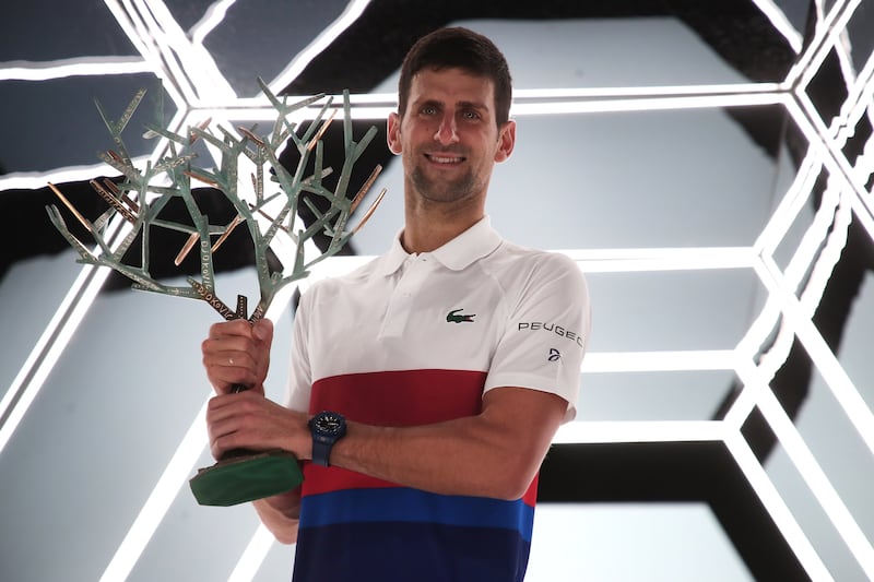 Novak Djokovic of Serbia celebrates with the trophy after winning the Rolex Paris Masters. EPA