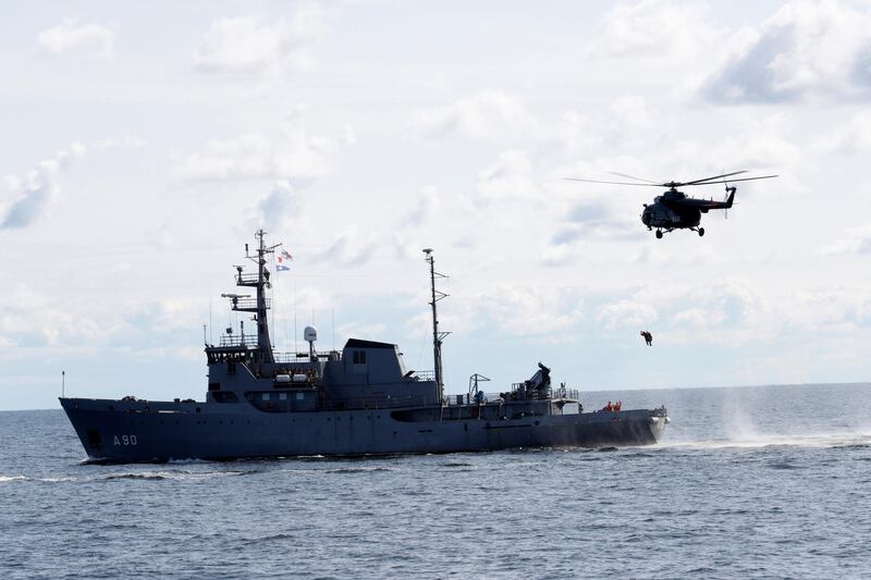 Latvian Air Force SAR helicopter performs rescue exercise from Latvian Navy supply vessel A90 Varonis during annual NATO multinational operation Open Spirit 2017 near Mersrags, Latvia August 28, 2017. REUTERS/Ints Kalnins