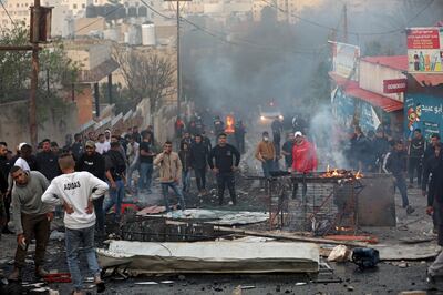 Palestinians clash with troops during an Israeli army raid in the West Bank town of Jenin. EPA