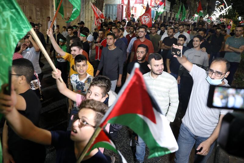 Palestinians march to celebrate the escape of the six Palestinian prisoners from the Israeli prison of Gilboa, in the West Bank city of Hebron.  Six Palestinians managed escape from the Gilboa prison through a tunnel.  Israeli security agencies launched a search operation for the prisoners including a former Fatah party leader in Jenin and five members of the Islamic Jihad movement who were serving life sentences.   EPA