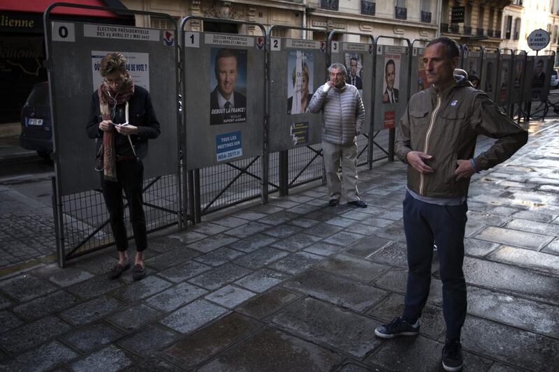 In Paris, voters were lining up early at polling stations. Emilio Morenatti/AP Photo