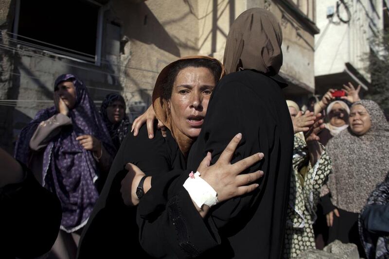 Women mourn during the funeral of four children killed in an Israeli bombardment on a beach in Gaza City last July. Photo by Heidi Levine for The National.