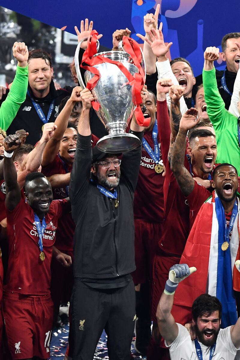 Liverpool manager Jurgen Klopp with the trophy after his team defeated Tottenham Hotspur in the Champions League final at the Wanda Metropolitan Stadium in Madrid on June 1, 2019. AFP