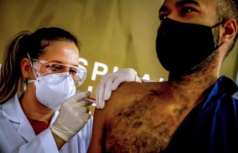 Health worker and volunteer Paulo Roberto Oliveira receives a Covid-19 vaccine produced by Chinese company Sinovac Biotech at the Sao Lucas Hospital, in Porto Alegre, southern Brazil. AFP