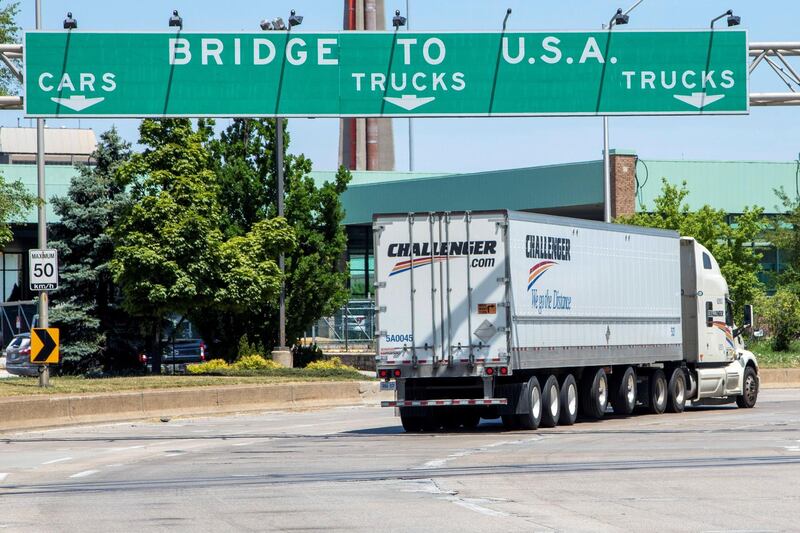 A truck heads towards the Ambassador Bridge, a main trade route linking Canada and the United States, as coronavirus disease (COVID-19) restrictions remain in place, in Windsor, Ontario, Canada July 5, 2020. Picture taken July 5, 2020. REUTERS/Carlos Osorio