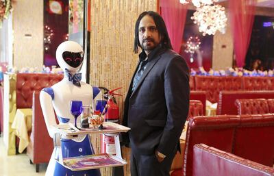 DUBAI , UNITED ARAB EMIRATES , JULY 16 – 2018 :- Arif Mohammad , MD of 4AM Group and owner with the robot name called ‘Ruby’ who serves food in the Drink and Spice Magics restaurant  in Bur Dubai in Dubai. ( Pawan Singh / The National )  For News. Story by Nick Webster 