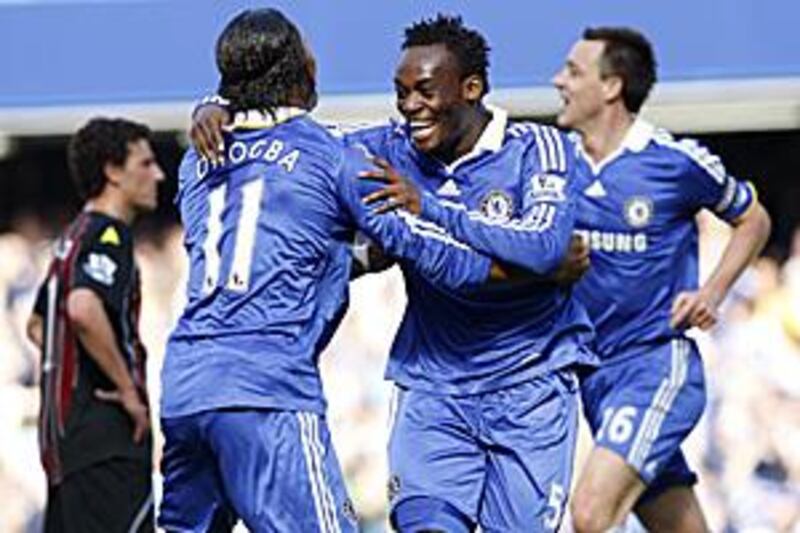 Michael Essien, centre, celebrates what turned out to be the winning goal with Chelsea teammate Didier Drogba.
