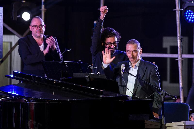 Ziad Rahbani greets the audience during his concert. EPA