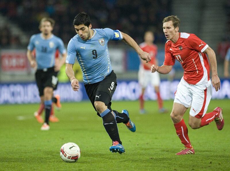 Luis Suarez and Uruguay drew Austria 1-1. They'll play in Group D at the 2014 World Cup against Costa Rica, England and Italy. Winnie Pessentheiner / Getty Images