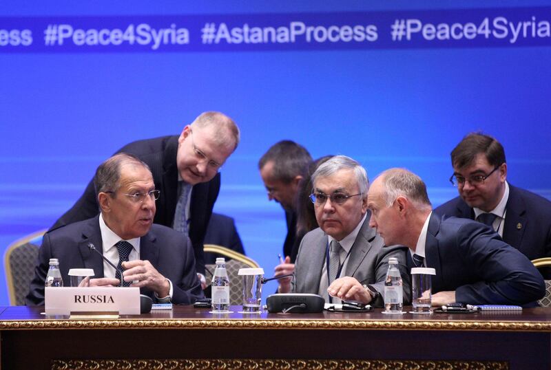 Russian Foreign Minister Sergei Lavrov, left, speaks with other participants during the international meeting on Syria in Astana, Kazakhstan on March 16, 2018. Mukhtar Kholdorbekov / Reuters