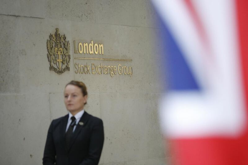 (FILES) In this file photo taken on October 03, 2018 a security guard stands by the entrance to the London Stock Exchange in London. The Hong Kong Stock Exchange on September 11, 2019 bid almost £32 billion for its London rival to bring together the largest financial hubs in Asia and Europe. / AFP / Tolga AKMEN
