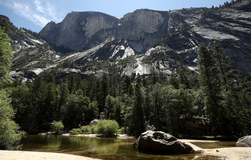 Visitors enjoy Mirror Lake in Yosemite National Park, California. Getty Images via AFP
