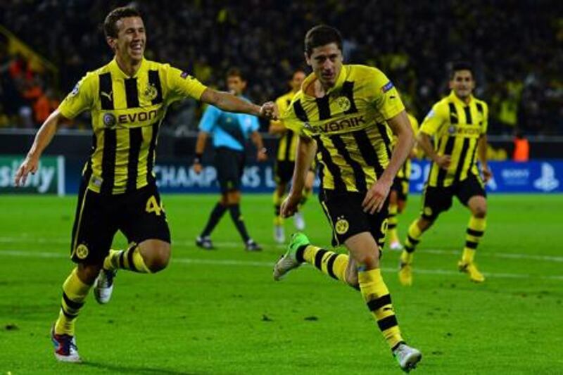 Borussia Dortmund striker Robert Lewandowski celebrates his late winner against Ajax