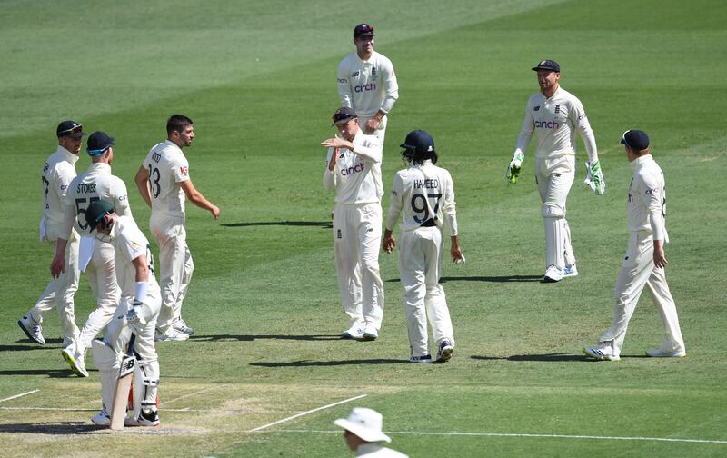 Joe Root, centre, of England signals for a DRS decision for Steve Smith of Australia, which was turned down. EPA
