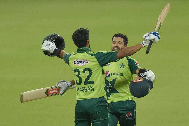 Pakistan's Hasan Ali, left, and Mohammad Rizwan celebrate after winning the the first T20 against South Africa at the Wanderers Stadium in Johannesburg on Saturday, April 10, 2021. AFP