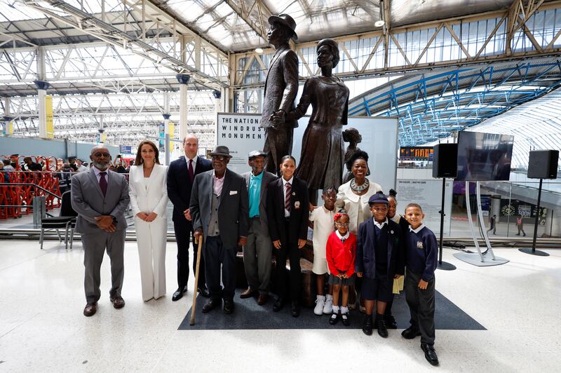 Prince William and Catherine, Duchess of Cambridge, with Baroness Floella Benjamin, Windrush passengers Alford Gardner and John Richards and children at the National Windrush Monument at Waterloo Station, London. Getty Images