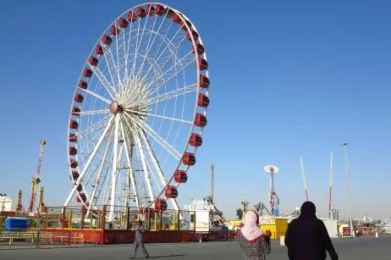 The Ferris wheel and other rides at Global Village remains closed after the January 24 accident that killed a man, but visitors are undeterred and continue to flock to the fair. Jeffrey E Biteng / The National