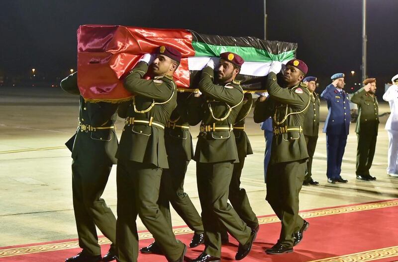 The bodies of the four Emirati serviceman killed in Yemen are carried off the military plane on Wednesday.
