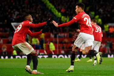 Manchester United's English striker Mason Greenwood (R) celebrates scoring their first goal to equalise 1-1 during the English Premier League football match between Manchester United and Everton at Old Trafford in Manchester, north west England, on December 15, 2019. RESTRICTED TO EDITORIAL USE. No use with unauthorized audio, video, data, fixture lists, club/league logos or 'live' services. Online in-match use limited to 120 images. An additional 40 images may be used in extra time. No video emulation. Social media in-match use limited to 120 images. An additional 40 images may be used in extra time. No use in betting publications, games or single club/league/player publications. / AFP / Oli SCARFF / RESTRICTED TO EDITORIAL USE. No use with unauthorized audio, video, data, fixture lists, club/league logos or 'live' services. Online in-match use limited to 120 images. An additional 40 images may be used in extra time. No video emulation. Social media in-match use limited to 120 images. An additional 40 images may be used in extra time. No use in betting publications, games or single club/league/player publications.