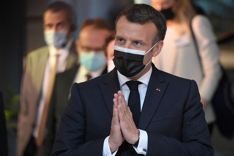 TOPSHOT - French President President Emmanuel Macron gestures during a press conference at the Europe Day ceremony and the Future of Europe conference at the European Parliament in Strasbourg, eastern France, on May 9, 2021. / AFP / Frederick FLORIN
