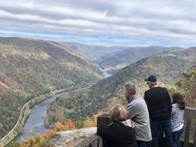 Visitors look down on the New River Gorge from a national park overlook in Grandview, West Virginia. AP