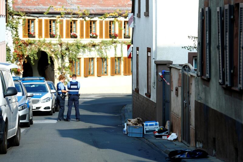 Police secure a crime scene where two people died during a police operation in Kirchheim an der Weinstrasse, Germany, October 19, 2018.     REUTERS/Ralph Orlowski