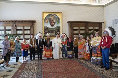 Indigenous delegates from Canada's First Nations pose for a photo with Pope Francis during a meeting at the Vatican, on March 31, 2022.  Vatican via Reuters