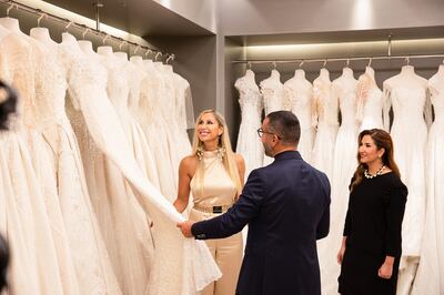 Bride Eve Jaso, host Khalil Zein and consultant Sara Al Salman browse dresses on Say Yes to the Dress Arabia. Photo: Warner Bros Discovery