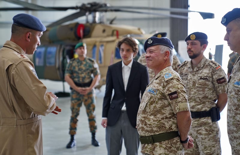 King Abdullah II, centre right, Crown Prince Hussein, second right, and Prince Hashem bin Abdullah, centre left, visit the King Abdullah II Airbase and tour Prince Al Hussein bin Abdullah II Aerial Reconnaissance Wing on July 24, 2022. AFP
