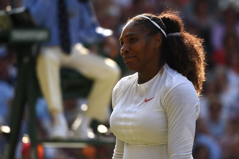 (FILES) In this file photo taken on July 14, 2018 US player Serena Williams reacts while playing against Germany's Angelique Kerber during their women's singles final match on the twelfth day of the 2018 Wimbledon Championships at The All England Lawn Tennis Club in Wimbledon, southwest London.
August 6, 2018, Serena Williams says she is suffering from "postpartum emotions" as the 23-time Grand Slam winner struggles to deal with juggling family life and tennis.  / AFP PHOTO / Oli SCARFF / RESTRICTED TO EDITORIAL USE