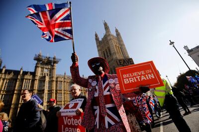 (FILES) In this file photo taken on February 27, 2019, pro-Brexit activists march outside the Houses of Parliament in central London. With Britain deadlocked on negotiating its divorce from the European Union, an unexpected side-front is emerging -- the US Congress. Conservatives who pushed the June 2016 referendum that ended in the shock decision to leave the 28-member bloc dangled the prospect of a free trade agreement with the United States as proof that Britain would not be isolated.
 / AFP / Tolga AKMEN
