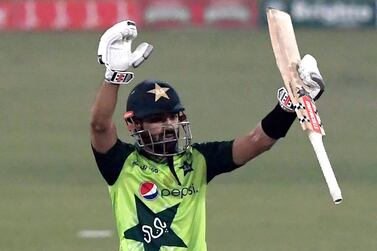 Pakistan's Mohammad Rizwan celebrates after scoring a half century (50 runs) during the second T20 international cricket match between Pakistan and South Africa at the Gaddafi Cricket Stadium in Lahore on February 13, 2021. / AFP / Aamir QURESHI