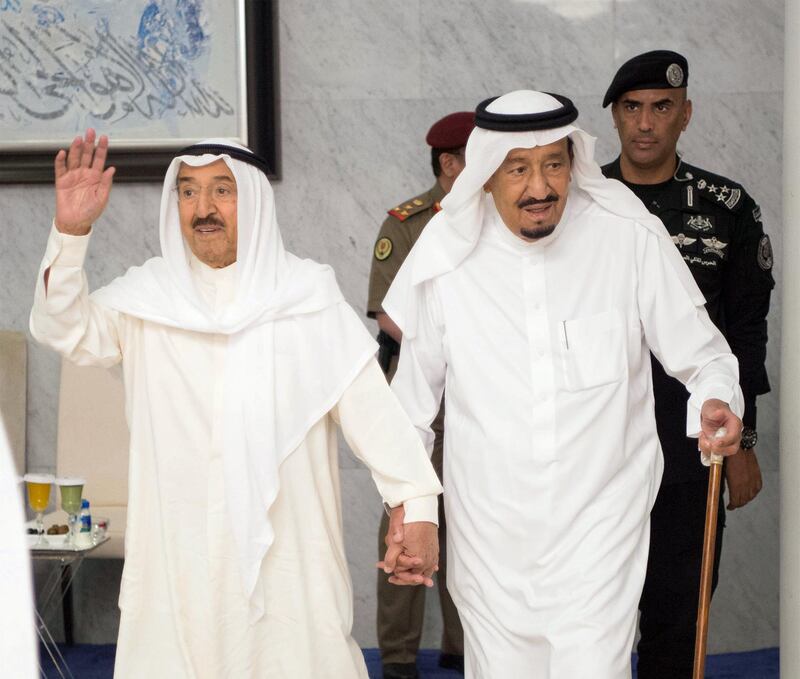 Saudi Arabia's King Salman bin Abdulaziz Al Saud (R) holds hands with Emir of Kuwait Sabah Al-Ahmad Al-Jaber Al-Sabah in Jeddah, Saudi Arabia, June 6, 2017. Bandar Algaloud/Courtesy of Saudi Royal Court/Handout via REUTERS ATTENTION EDITORS - THIS PICTURE WAS PROVIDED BY A THIRD PARTY. FOR EDITORIAL USE ONLY.