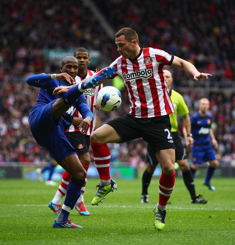 SUNDERLAND, ENGLAND - MAY 13:  Ashley Young of Manchester United is tackled by Phil Bardsley of Sunderland during the Barclays Premier League match between Sunderland and Manchester United at Stadium of Light on May 13, 2012 in Sunderland, England.  (Photo by Clive Mason/Getty Images)