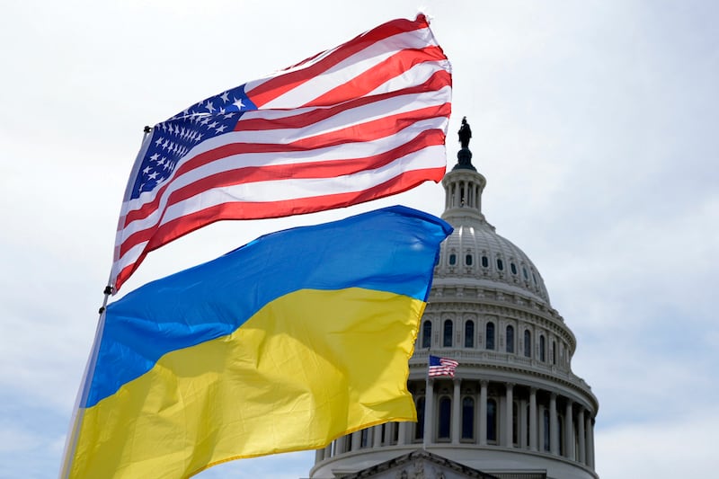 The American and Ukrainian flags wave outside the Capitol in Washington. AP