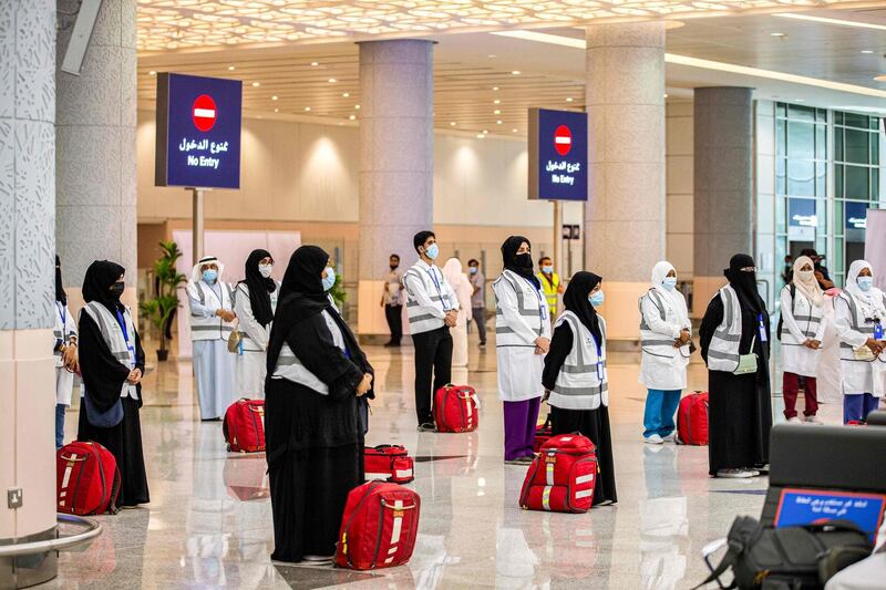 A handout picture provided by the Saudi Ministry of Hajj and Umra on July 25, 2020, shows members of the medical team from Saudi Health ministry awaiting the first group of arrivals for the annual Hajj pilgrimage, at the Red Sea coastal city of Jeddah's King Abdulaziz International Airport. The 2020 hajj season, which has been scaled back dramatically to include only around 1,000 Muslim pilgrims as Saudi Arabia battles a coronavirus surge, is set to begin on July 29. Some 2.5 million people from all over the world usually participate in the ritual that takes place over several days, centred on the holy city of Mecca. This year's hajj will be held under strict hygiene protocols, with access limited to pilgrims under 65 years old and without any chronic illnesses. - === RESTRICTED TO EDITORIAL USE - MANDATORY CREDIT "AFP PHOTO / HO / MINISTRY OF HAJJ AND UMRA" - NO MARKETING NO ADVERTISING CAMPAIGNS - DISTRIBUTED AS A SERVICE TO CLIENTS ===
 / AFP / Saudi Ministry of Hajj and Umra / - / === RESTRICTED TO EDITORIAL USE - MANDATORY CREDIT "AFP PHOTO / HO / MINISTRY OF HAJJ AND UMRA" - NO MARKETING NO ADVERTISING CAMPAIGNS - DISTRIBUTED AS A SERVICE TO CLIENTS ===

