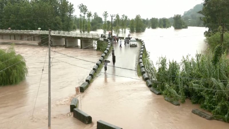 A flooded bridge after heavy rain in Mandi, Himachal Pradesh. Reuters