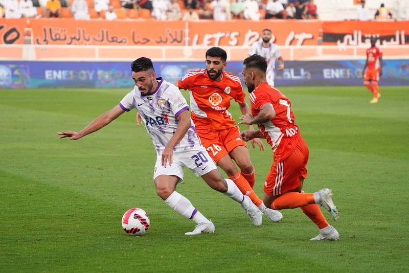 Al Ain, in white, kicked off their Adnoc Pro League title defence with a 1-1 draw away to Ajman. Photo: AGL