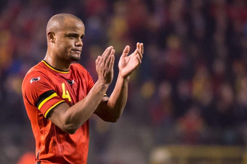 Vincent Kompany and Belgium drew Ivory Coast 2-2. They'll play in Group H at the 2014 World Cup with Algeria, Russia and South Korea. Geer Vanden Wijngaert / AP