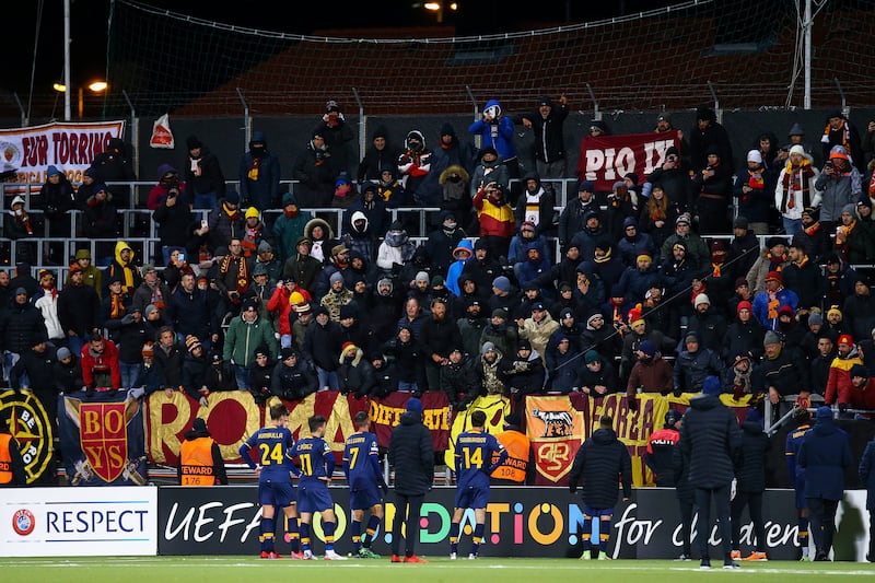 Roma players stand with the fans after the 6-1 defeat to Bodo/Glimt. AP