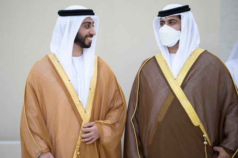 Sheikh Zayed bin Mansour bin Zayed (L) speaks with Sheikh Hazza bin Hamdan bin Zayed (R) during their wedding at Qasr Al Hosn. 