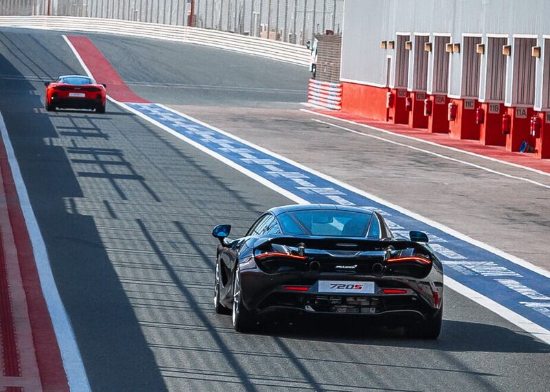 A McLaren GT and 720S leave the pit lane.