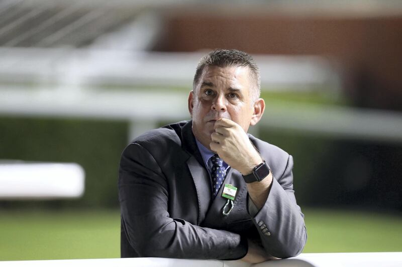 Dubai, United Arab Emirates - October 24, 2019: Trainer Doug Watson watches from the sidelines on the opening meeting of the new season. Thursday the 24th of October 2019. Meydan Racecourse, Dubai. Chris Whiteoak / The National